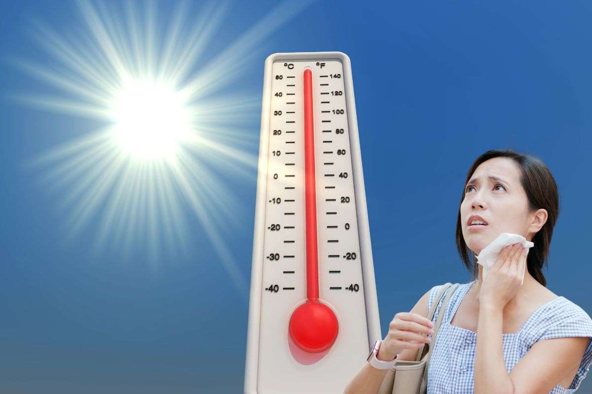 alte temperature e donna che ha caldo